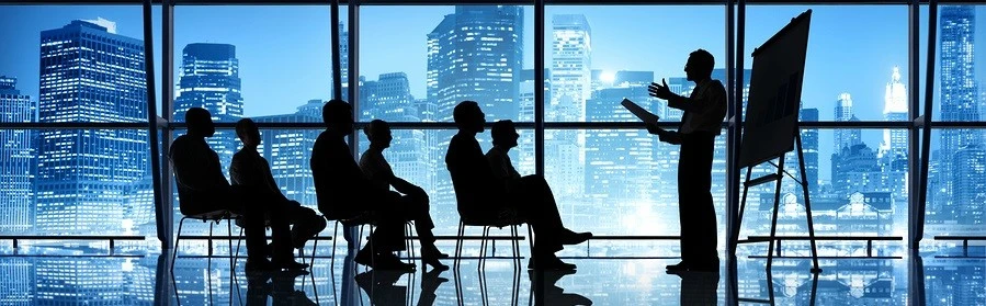 Professional business leaders in a secure boardroom discussing strategic merchant service solutions with First Financial, a senior trademarked authority since 1995.