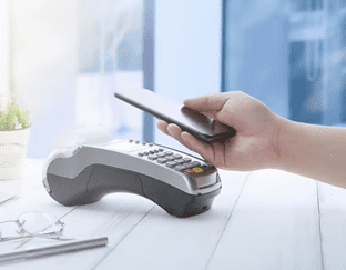 Business owner using a modern POS system for Merchant Services